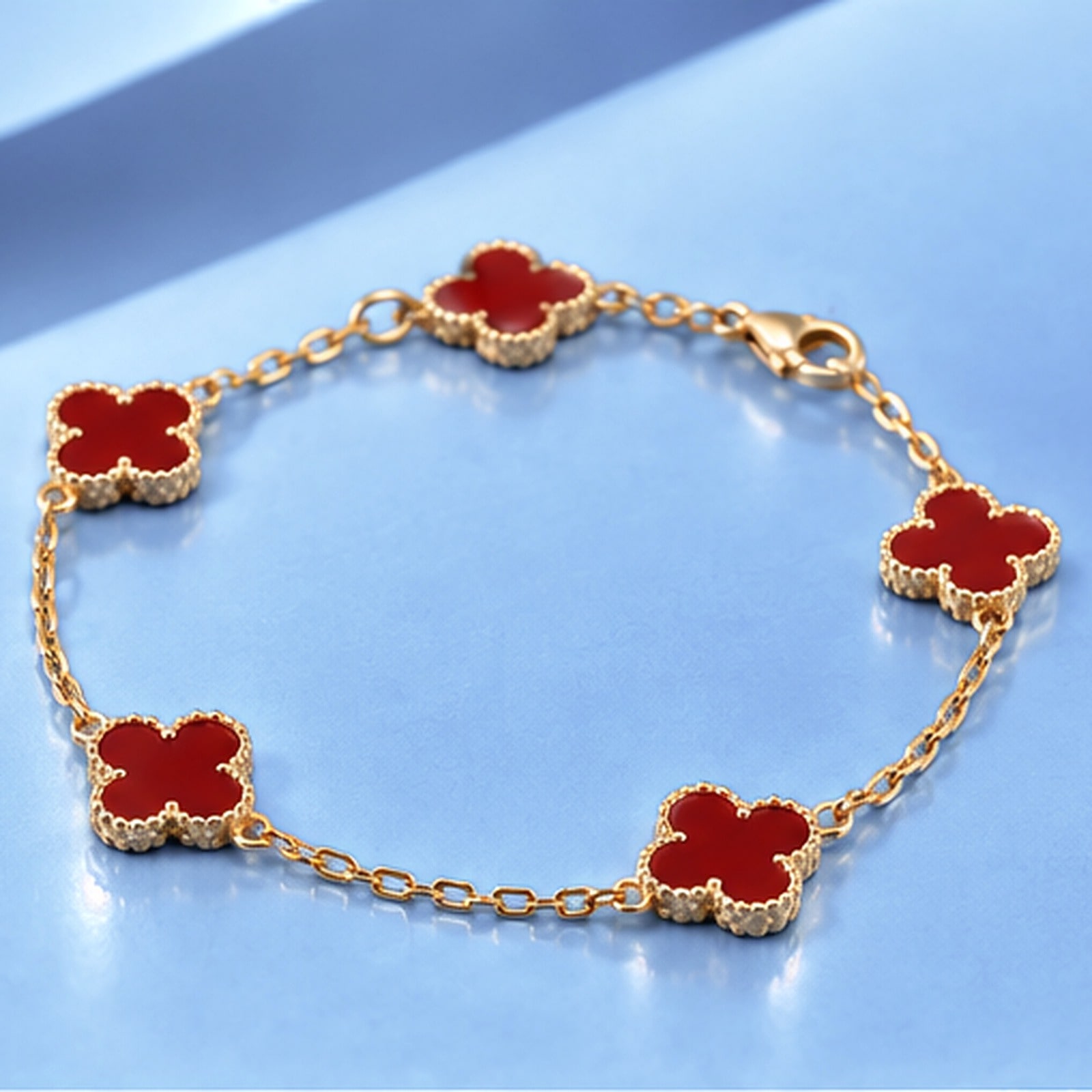 Gold bracelet with carnelian in the style of van cleef