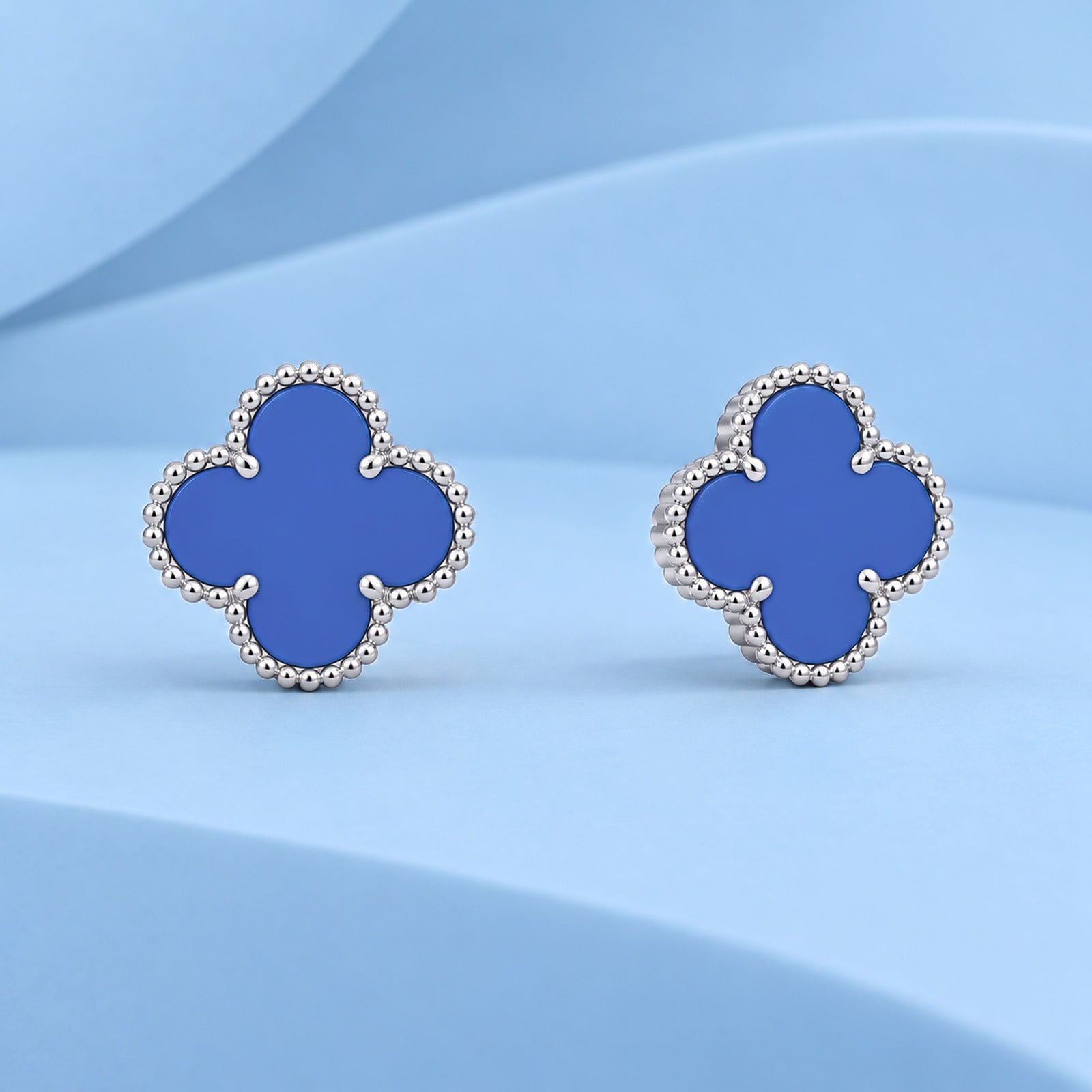 Gold earrings with agate in the style of van cleef