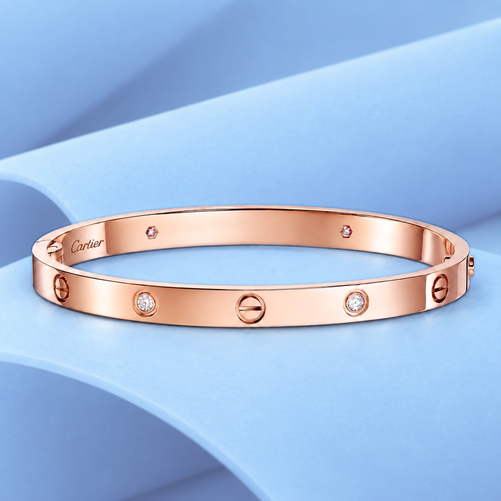 Gold bracelet with diamonds in the style of cartier