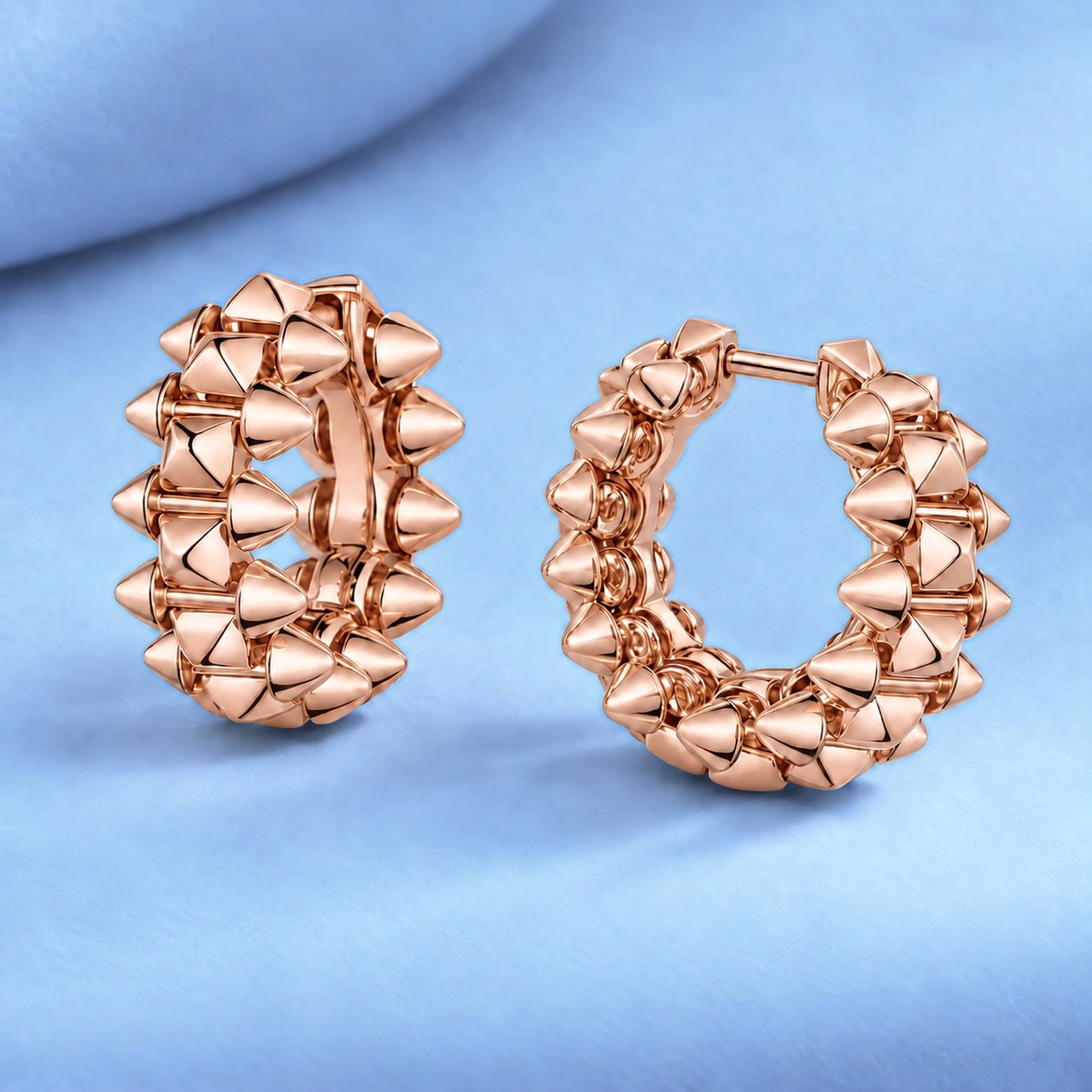 Gold earrings in the style of cartier