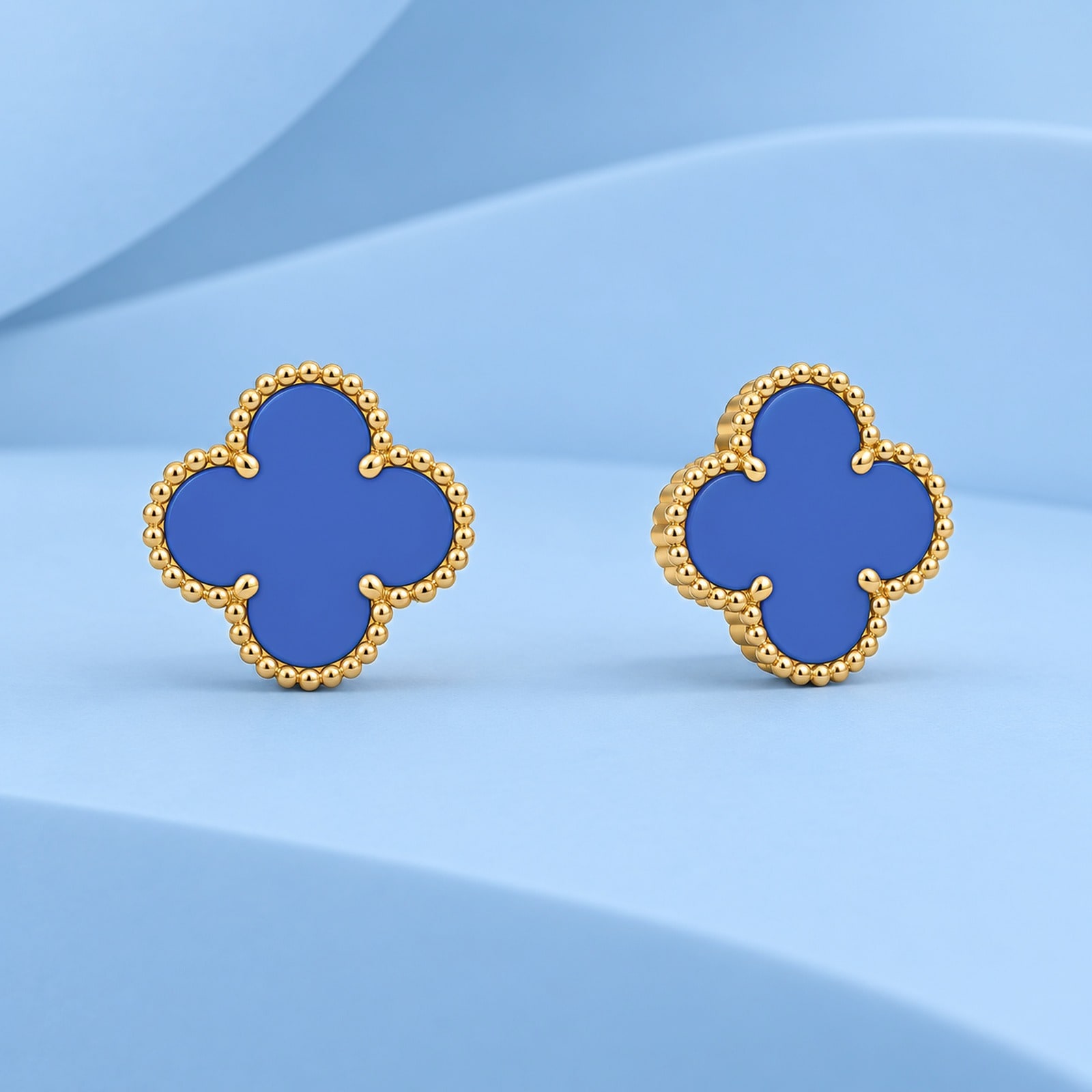 Gold earrings with agate in the style of van cleef