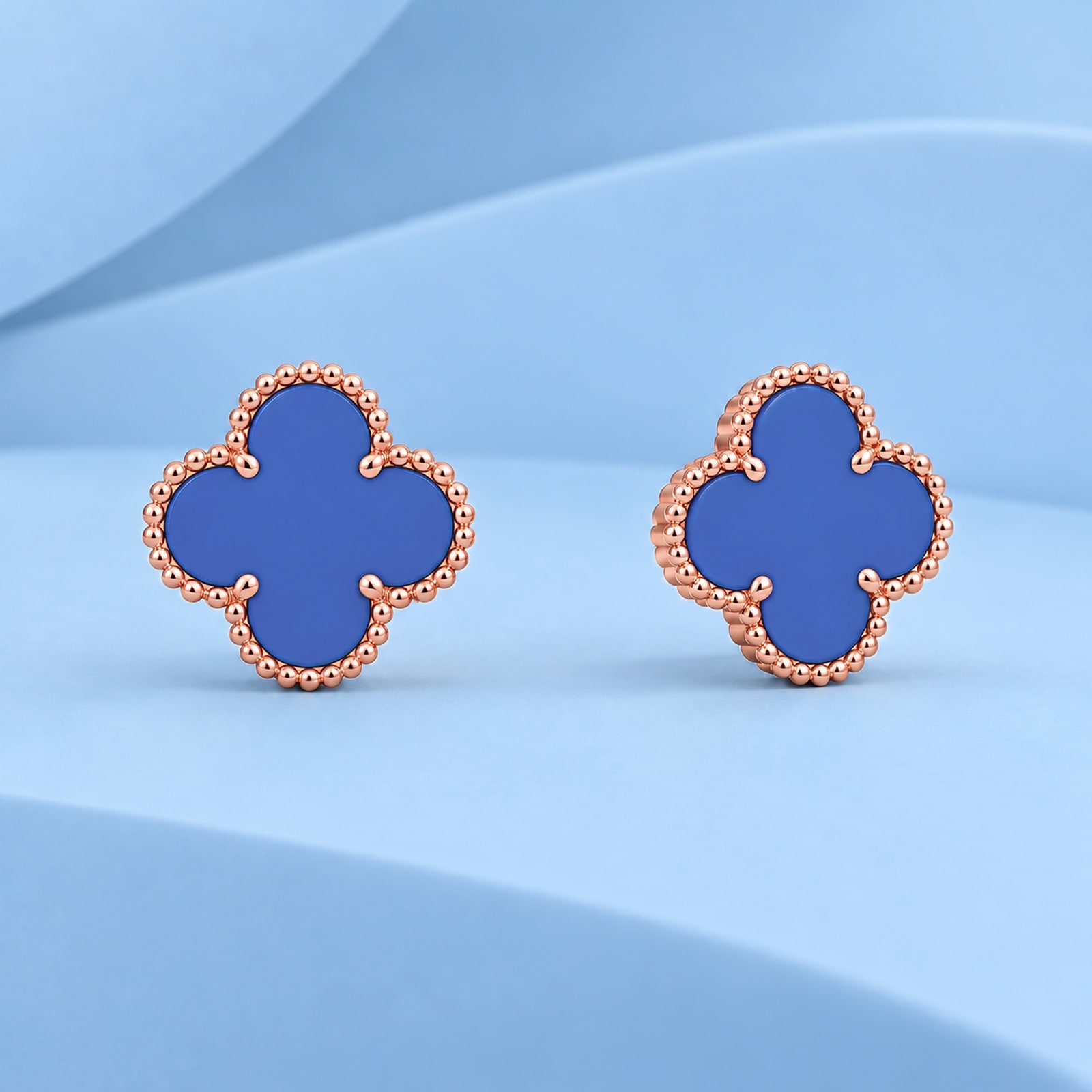 Gold earrings with agate in the style of van cleef