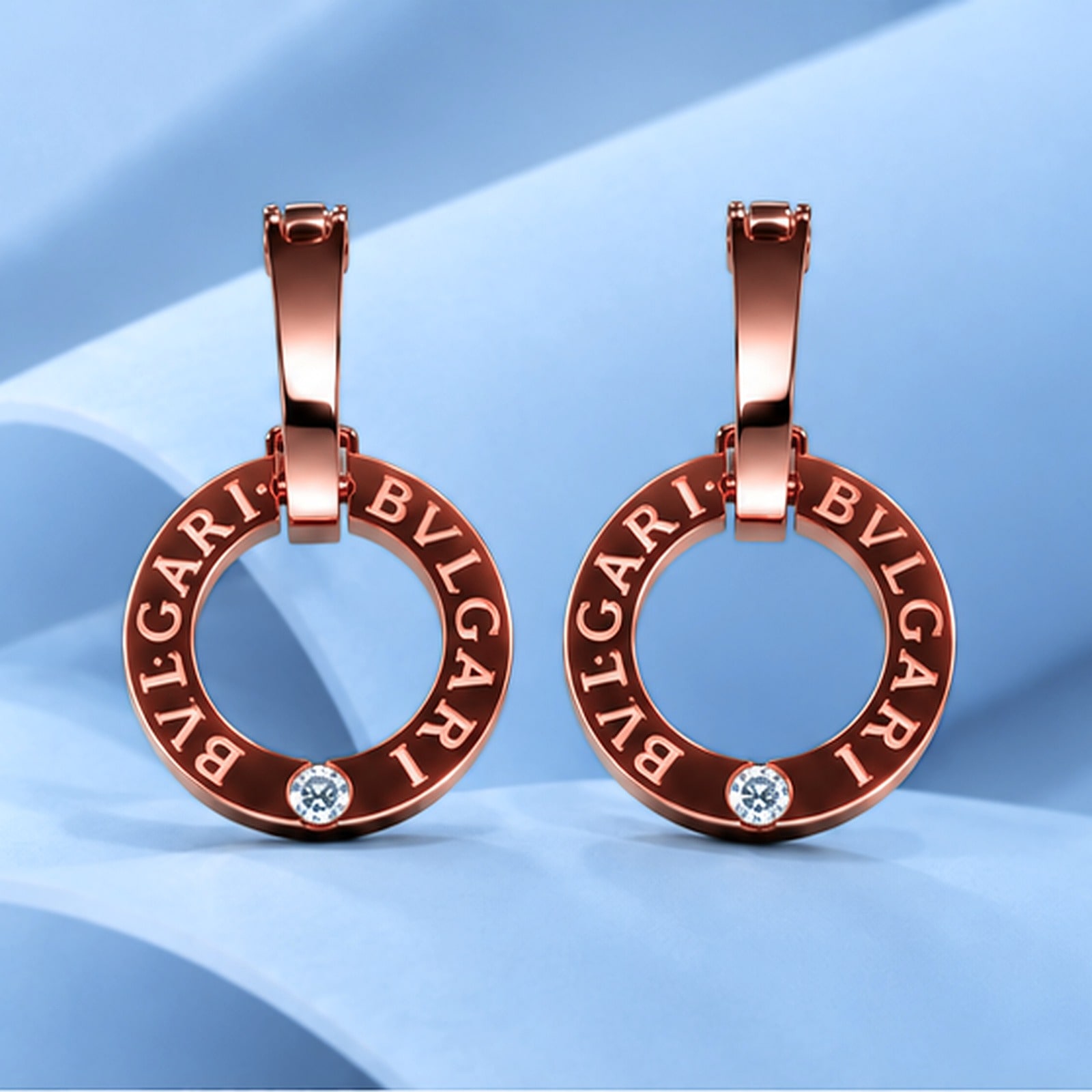 Gold earrings with diamonds in the style of bulgari