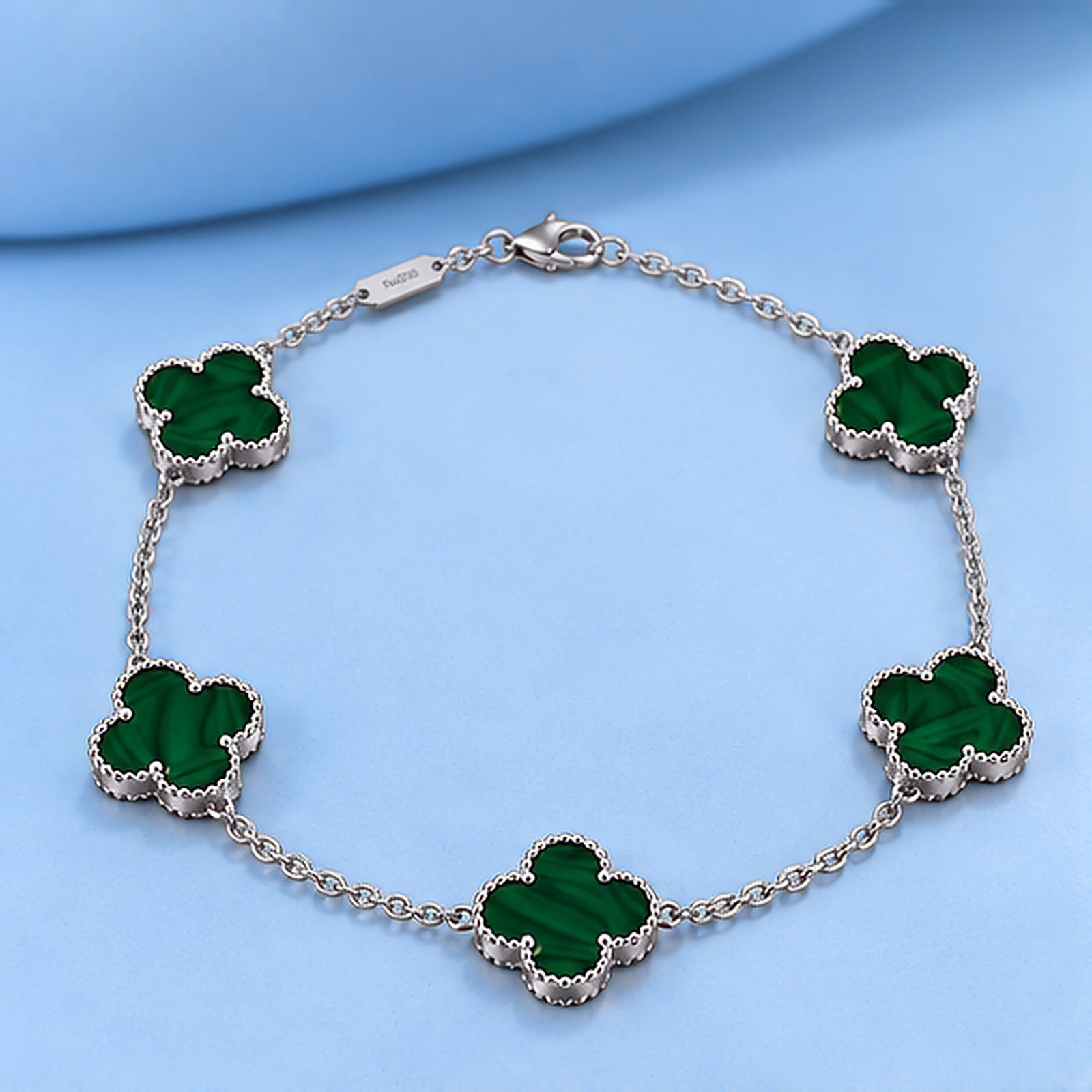 Gold bracelet with malachite in the style of van cleef
