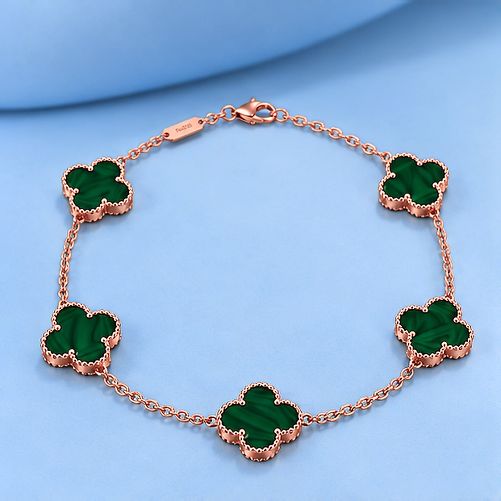 Gold bracelet with malachite in the style of van cleef