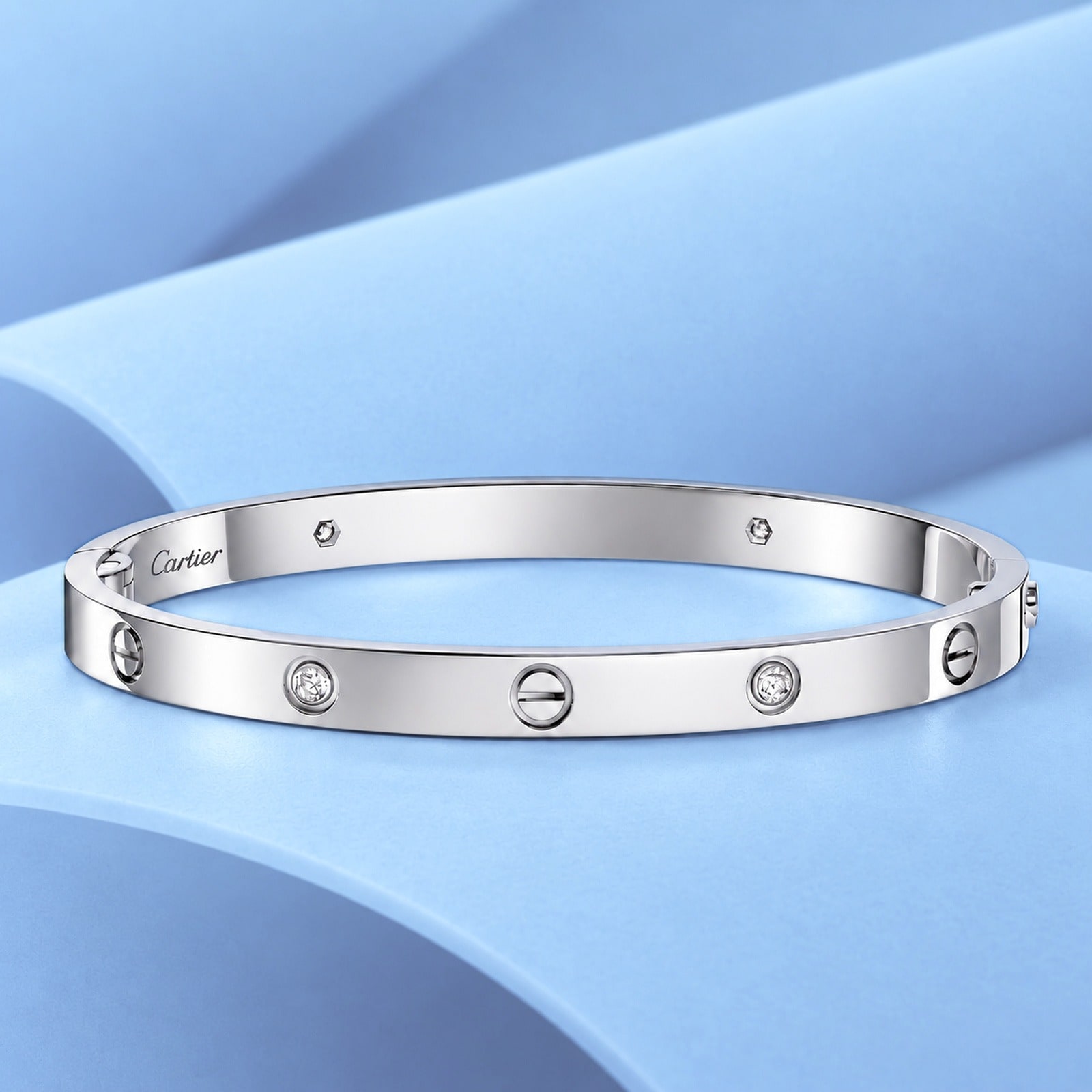 Gold bracelet with diamonds in the style of cartier