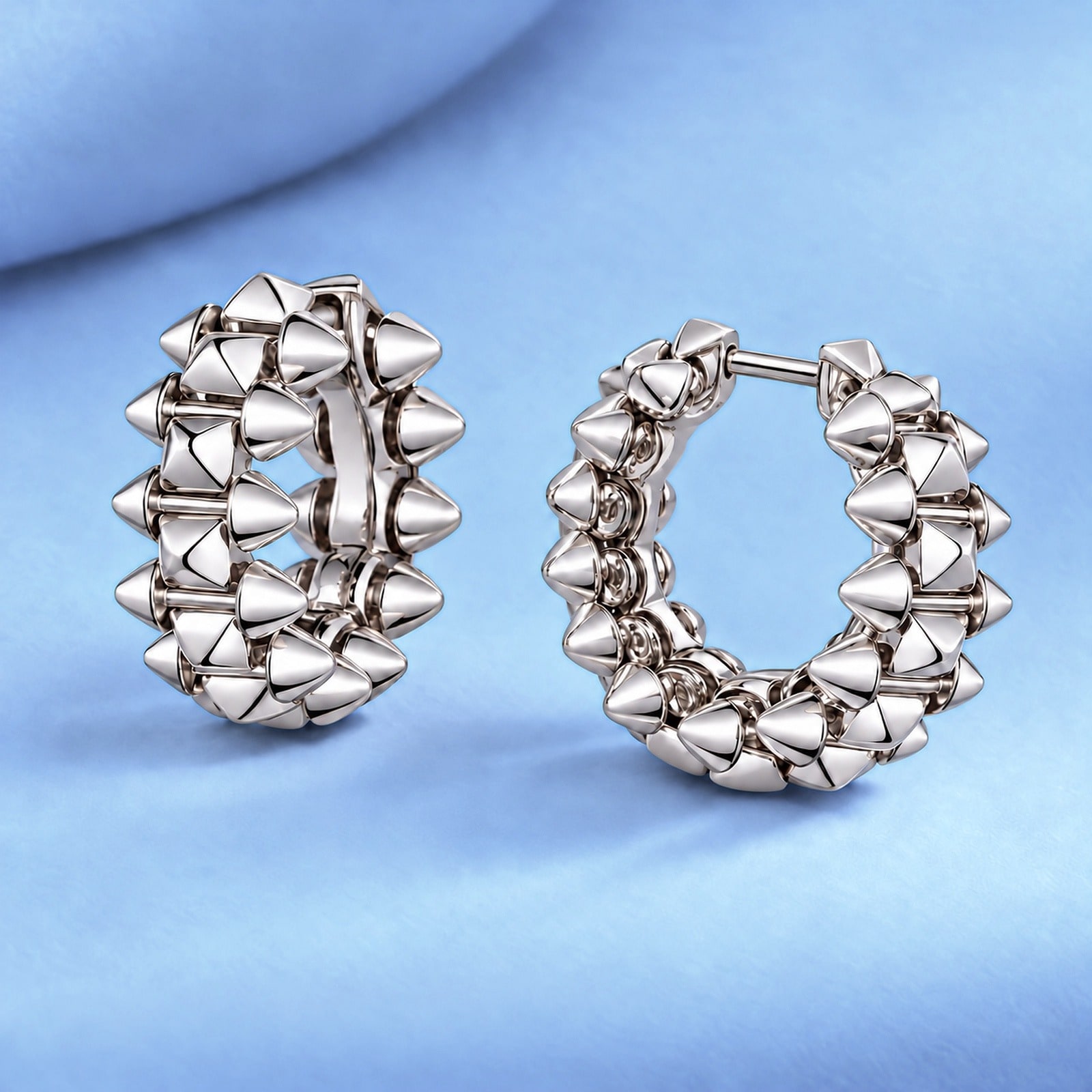 Gold earrings in the style of cartier