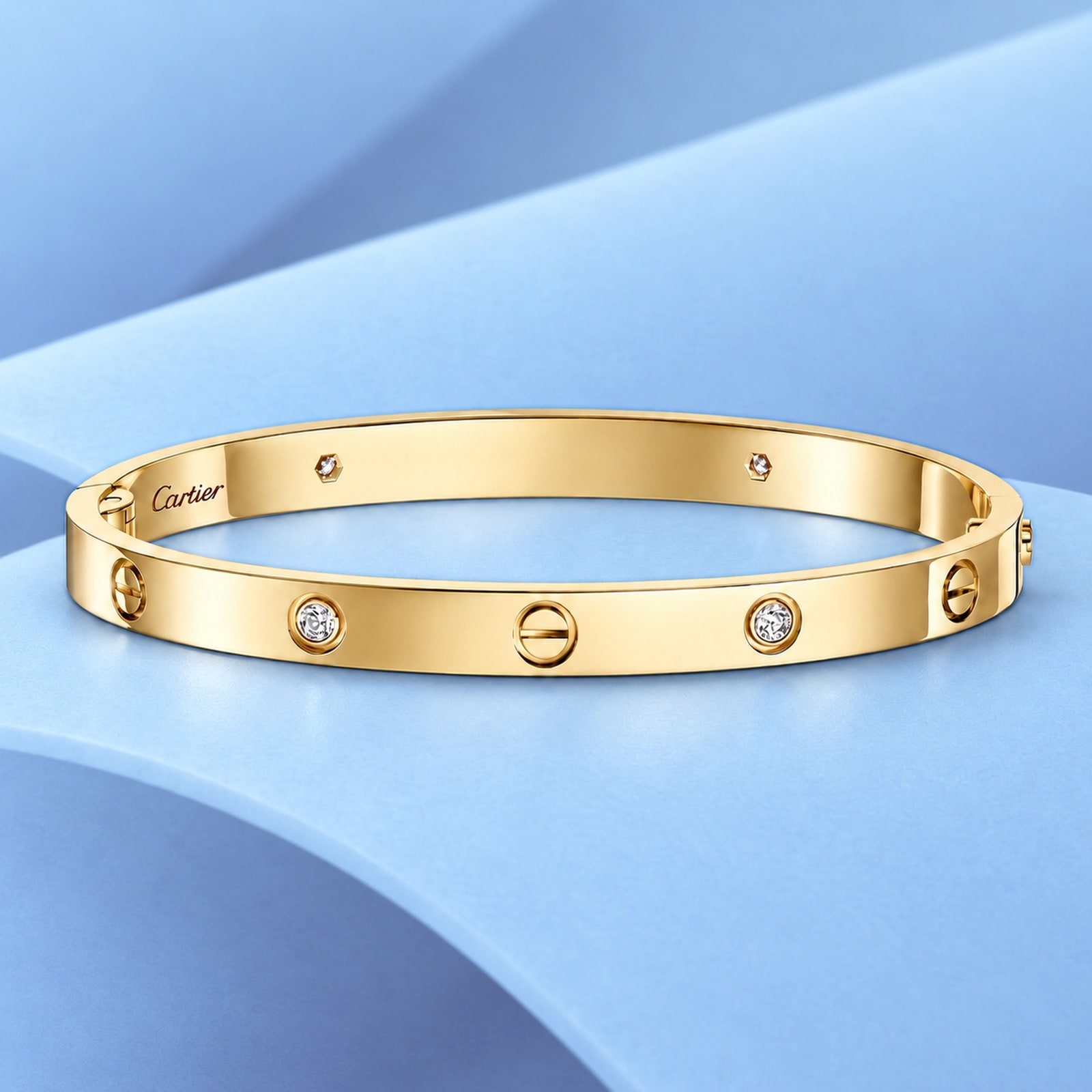 Gold bracelet with diamonds in the style of cartier