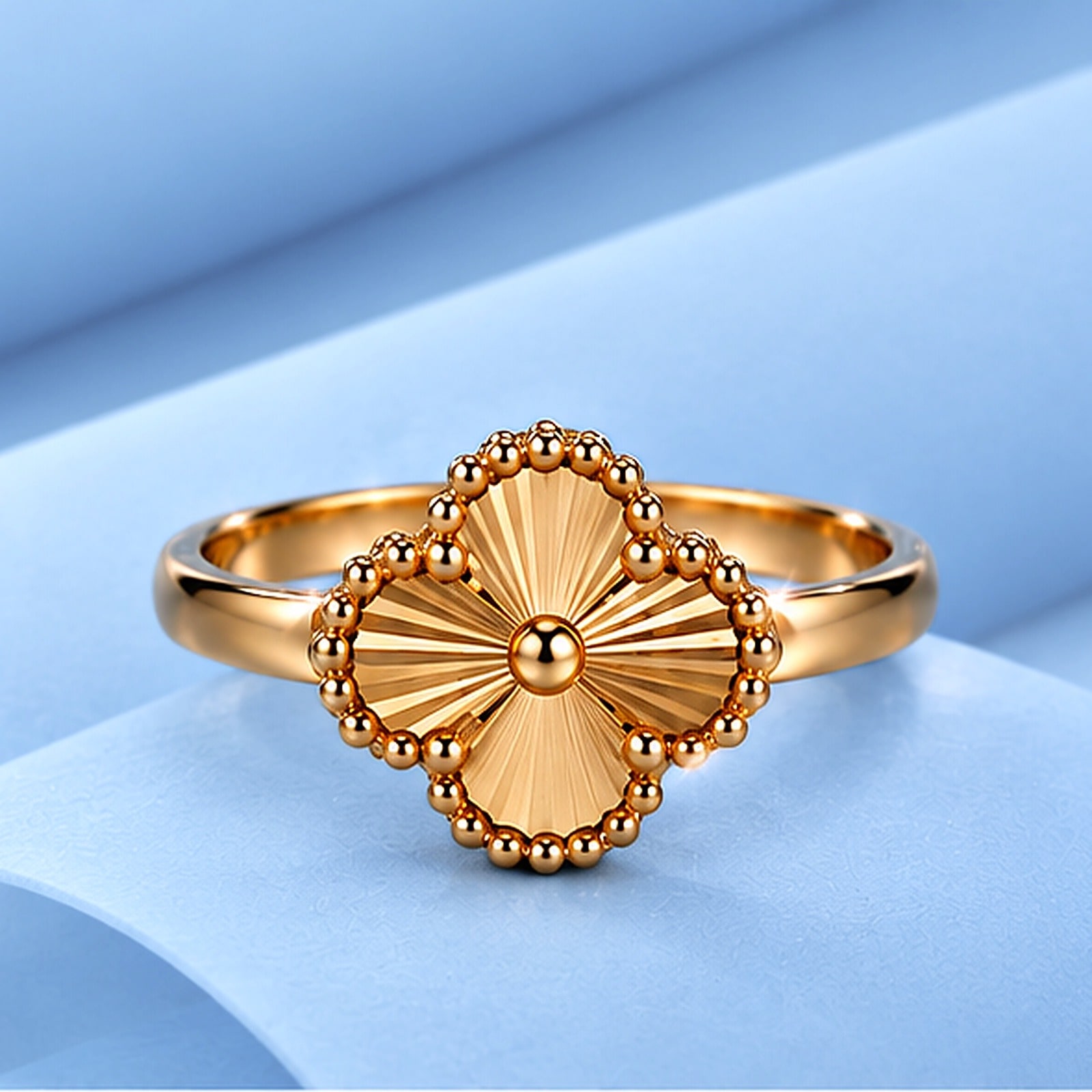 Gold ring in the style of van cleef